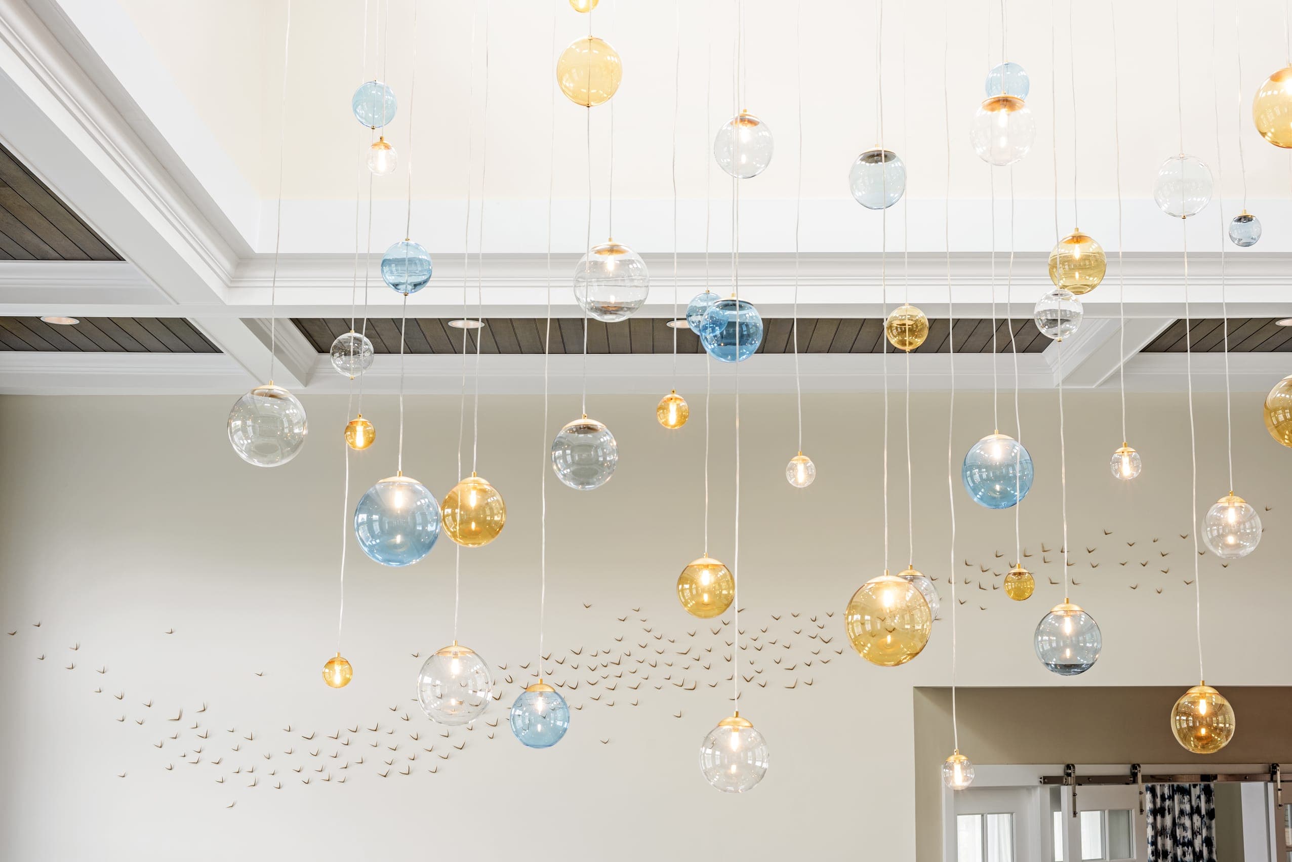 Assortment Of Glass Bubble Lighting Fixtures Wood Panel Ceiling