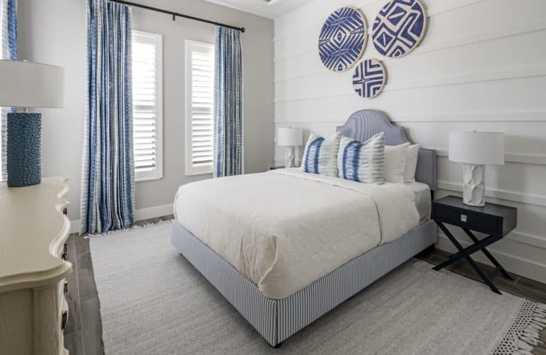 White Slat Bedroom With Blue Accents